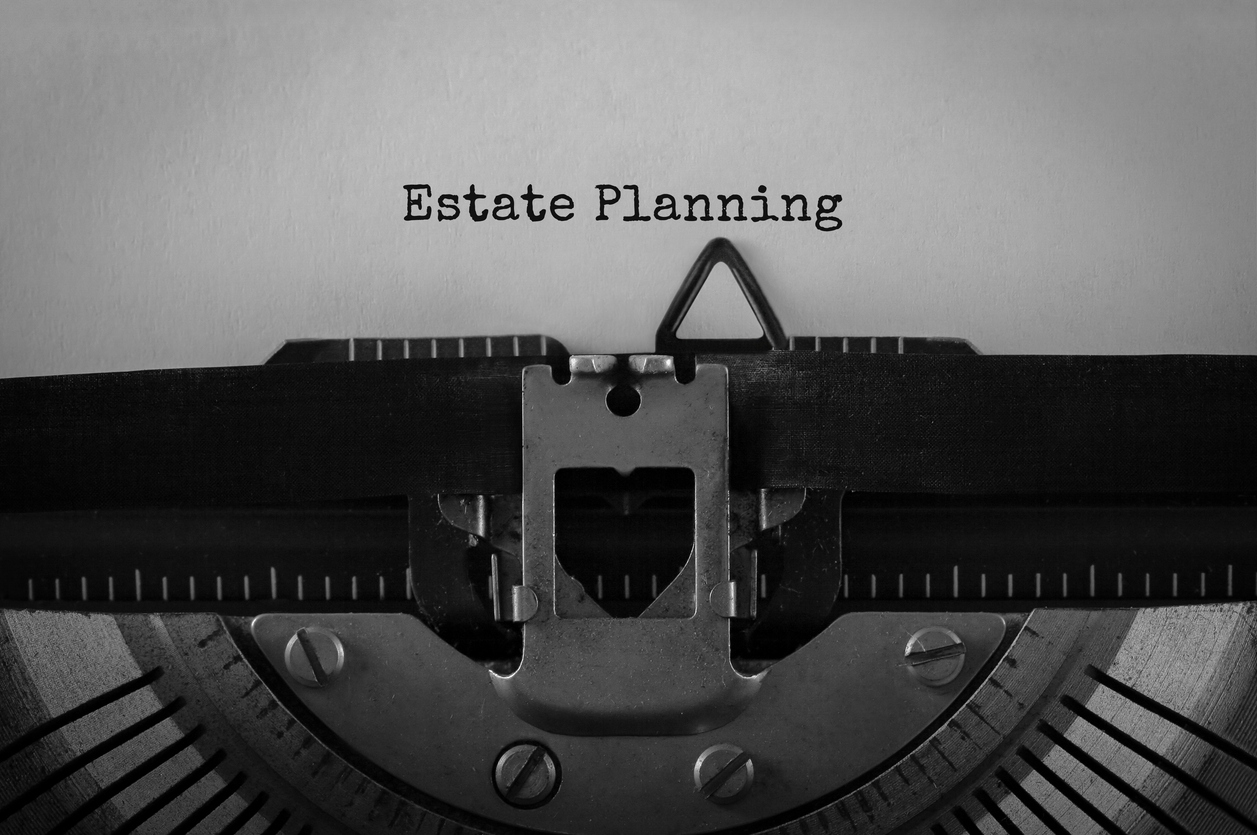"Estate planning" typed out on a typewriter.