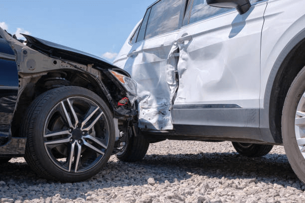 Up close view of a black car hitting the side of a white SUV.